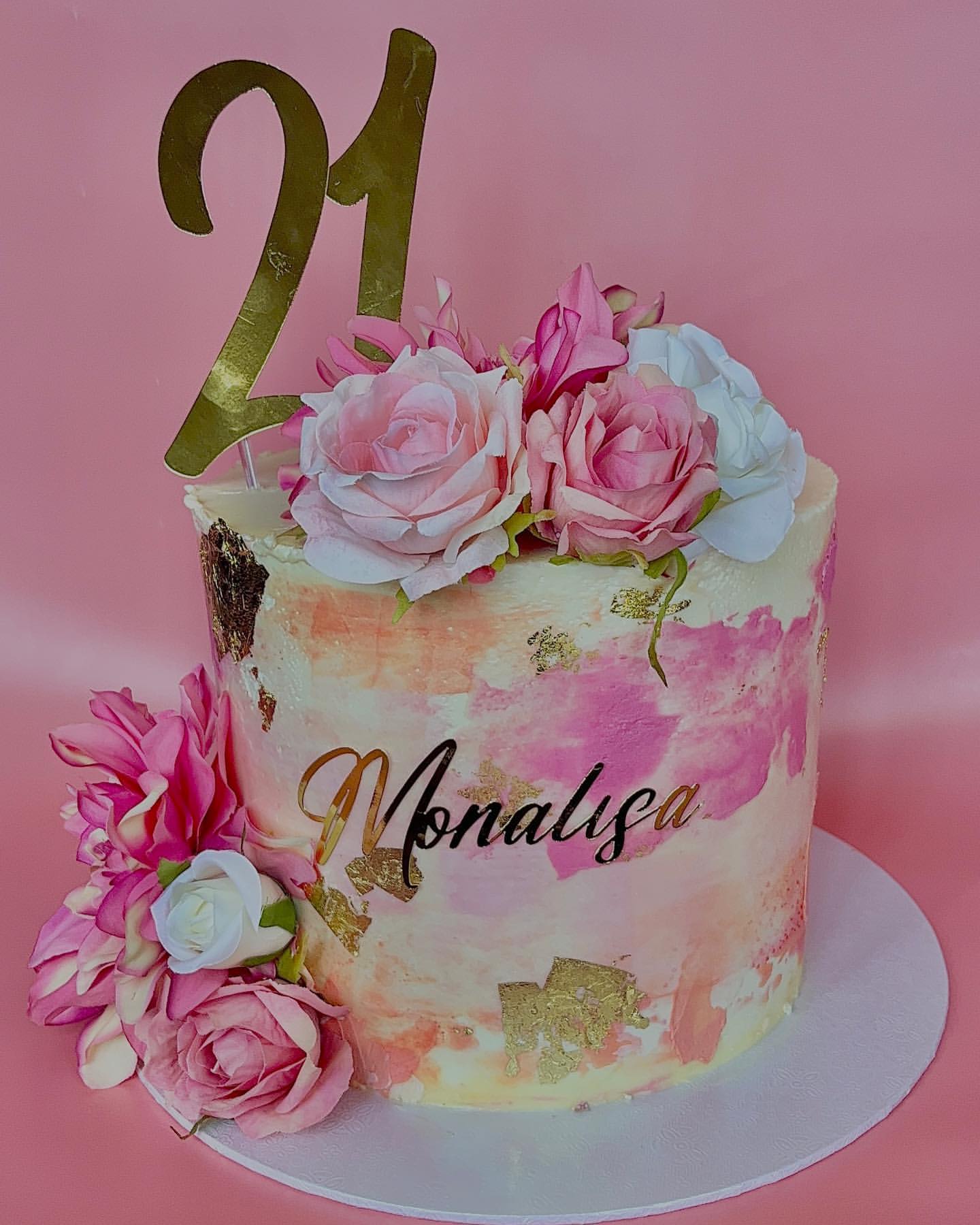 Tall pink watercolour buttercream cake with gold leaf and fresh-style roses